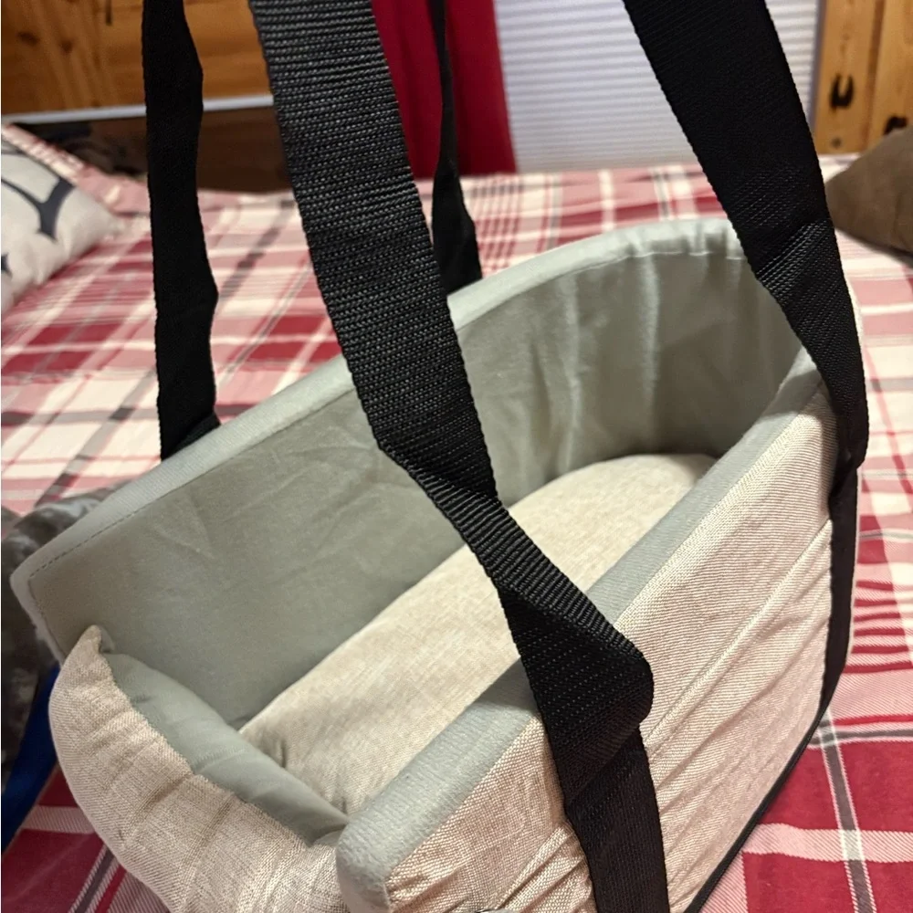cream colored dog carrier.